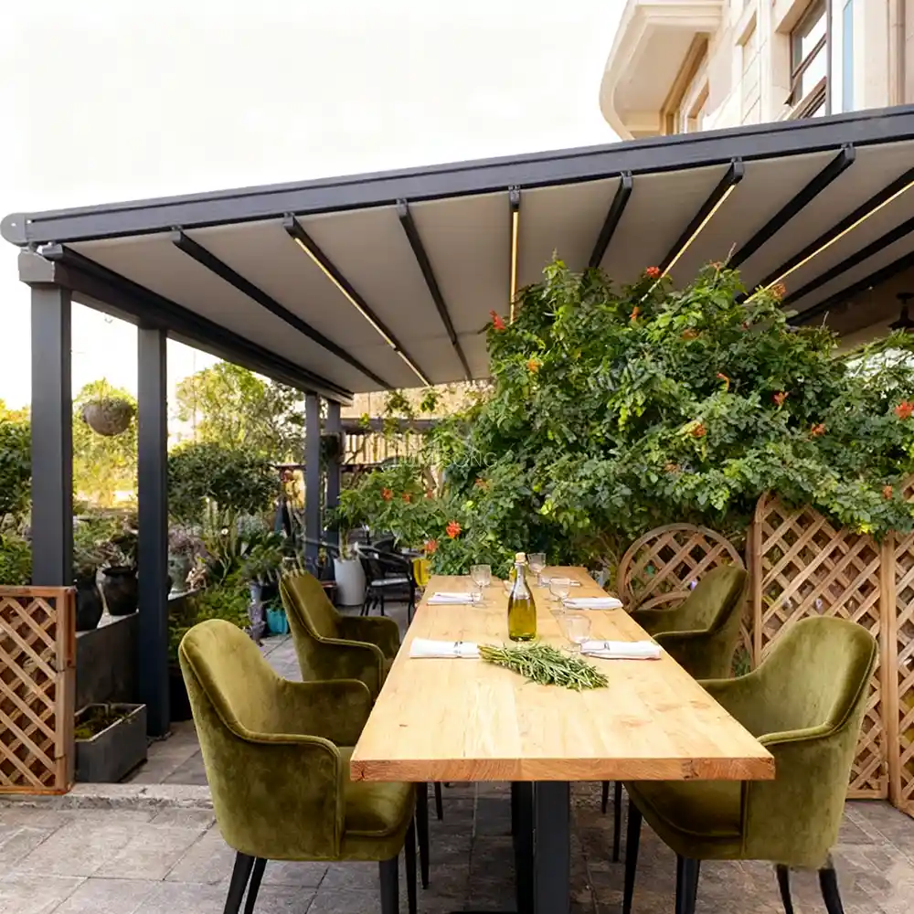 Commercial freestanding awning system with an independent dual-sided retractable structure and waterproof heavy-duty fabric shelter, installed for a luxury bistro outdoor restaurant dining floor by Lumisong.